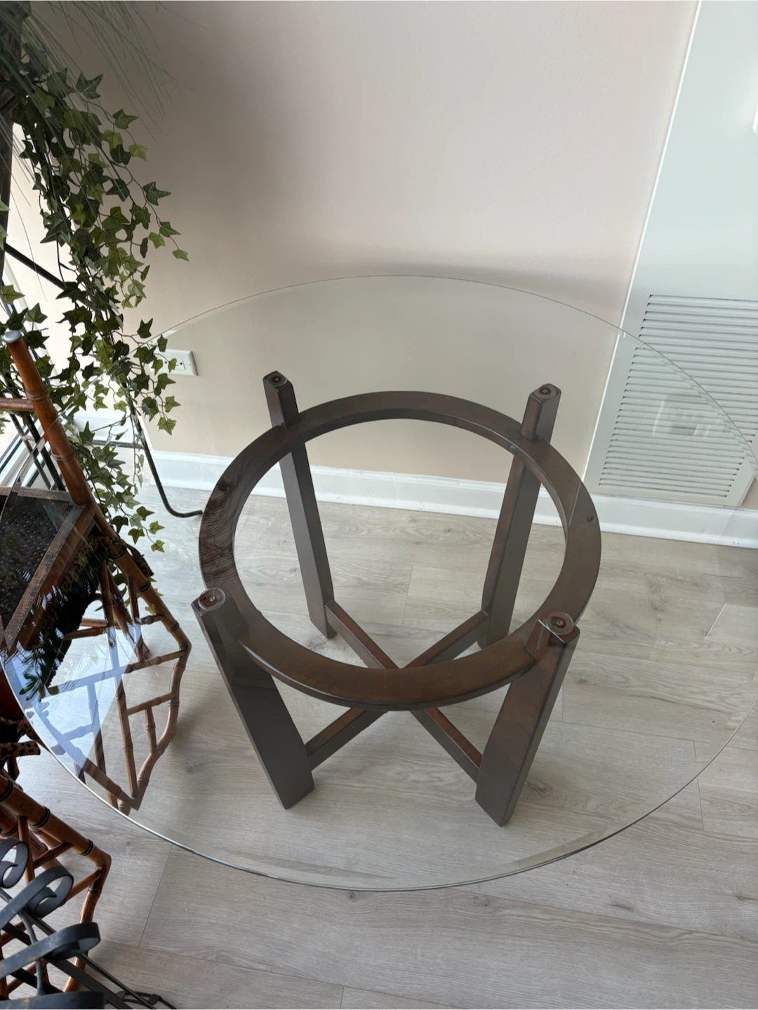 45” Glass round dining table with oak base with a dark stain