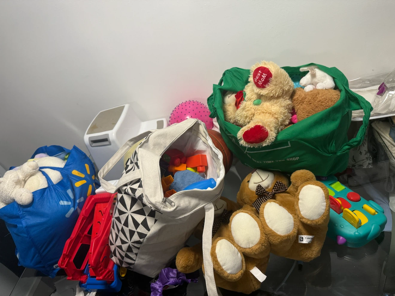 Bundle of assorted stuffed animals and toys