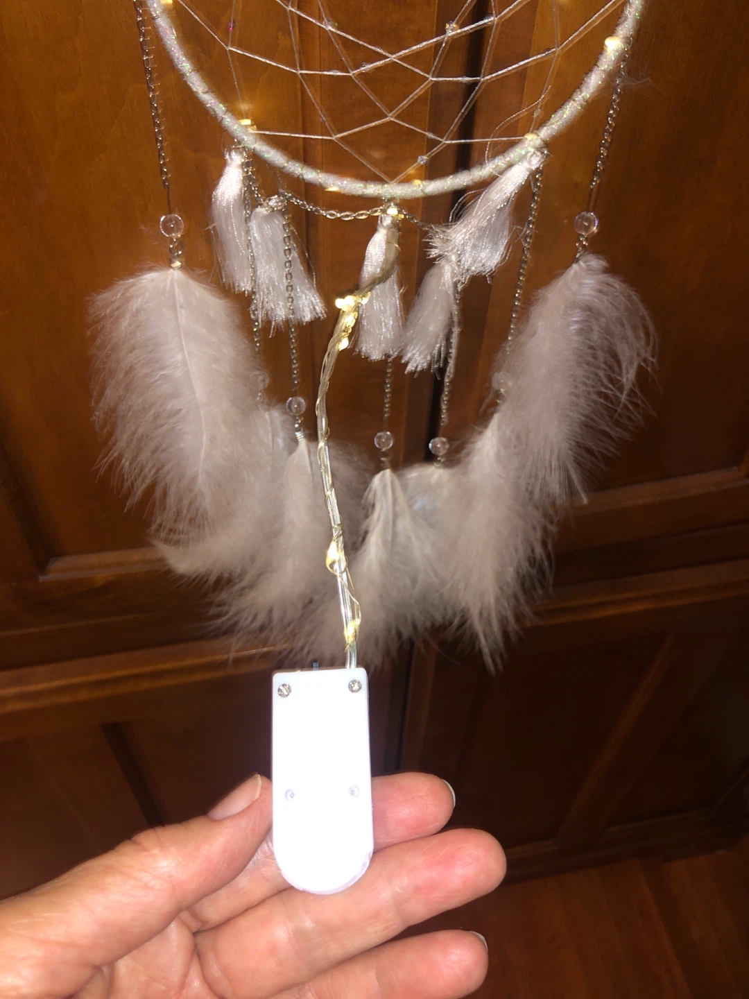 White dreamcatcher with white feathers