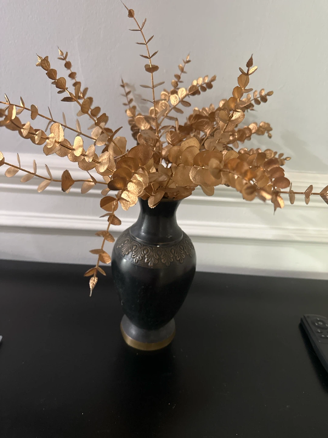Gold Eucalyptus Branches in Black Vase