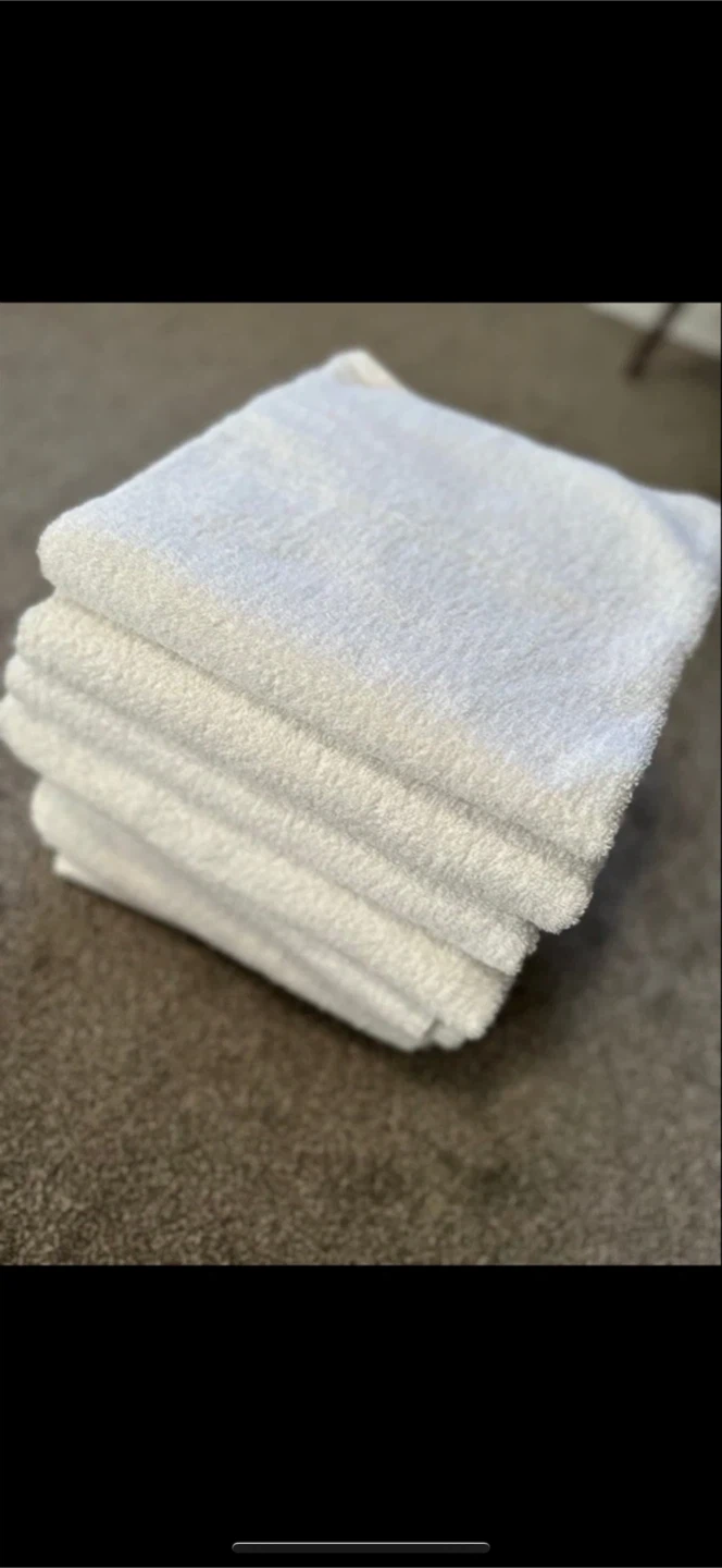 Stack of white towels (x8)