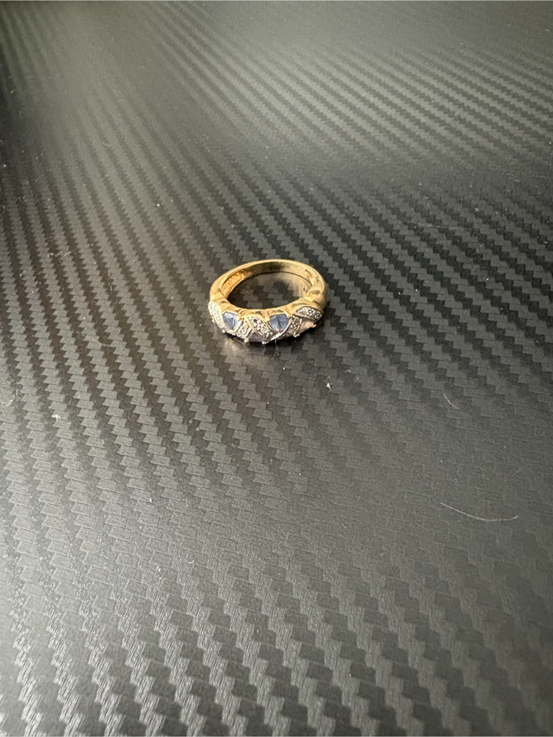 Gold-tone ring with blue and white stones