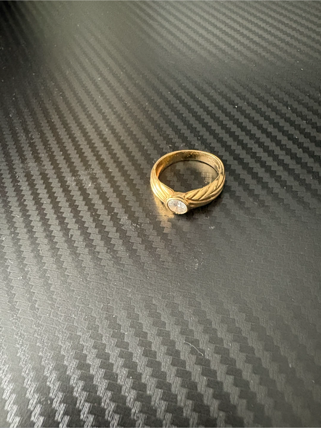 Gold-tone ring with clear stone