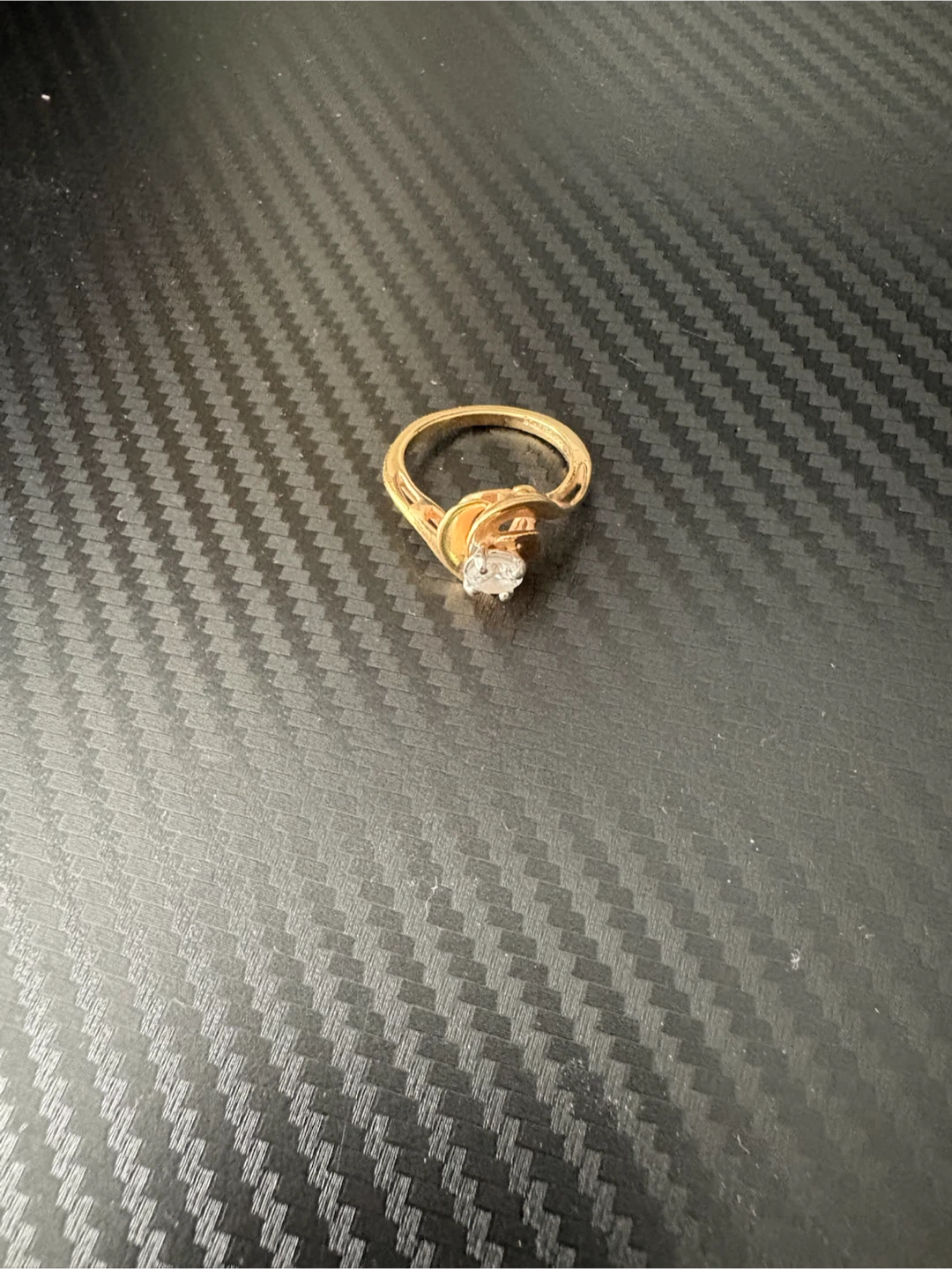 Gold-tone ring with clear stone