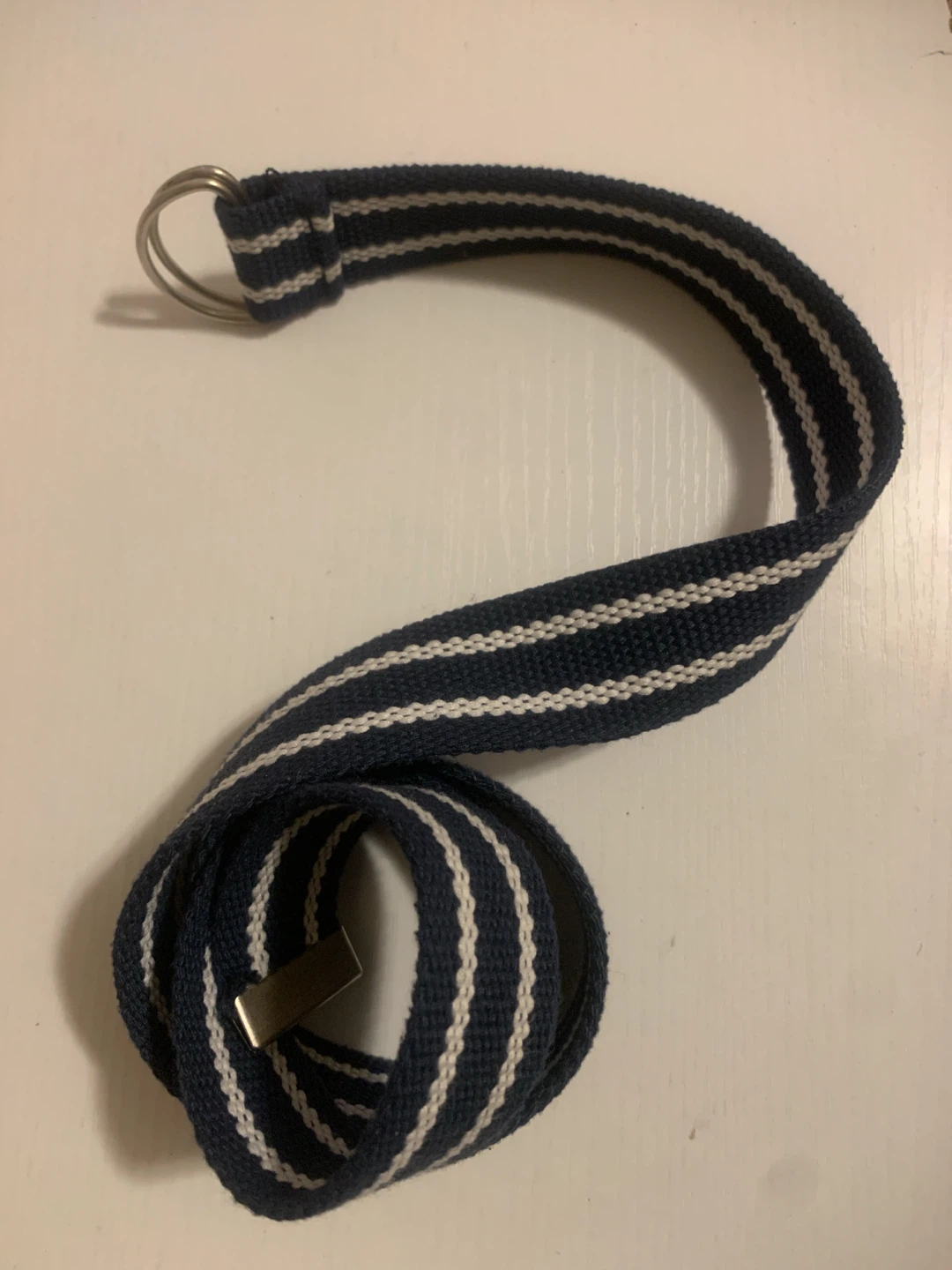 Navy and white striped canvas belt with double D-ring buckle