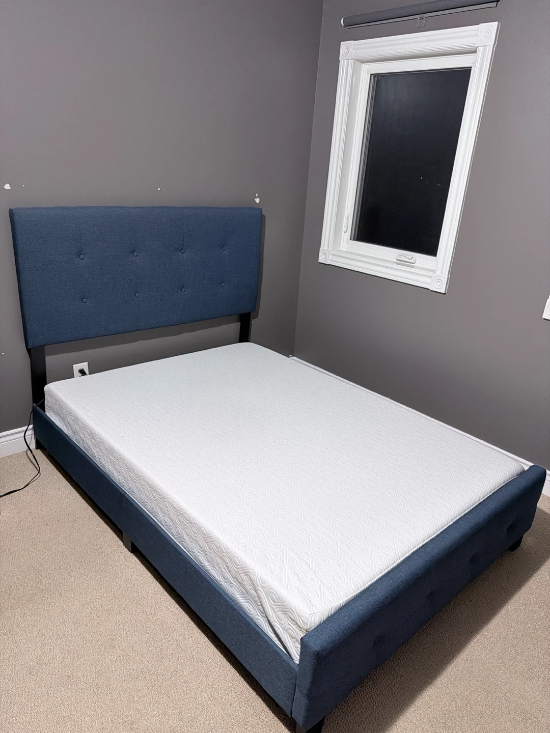 Blue Upholstered Bed Frame with Tufted Headboard.