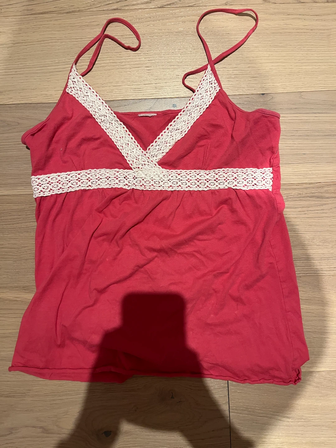 Pink camisole with white lace trim