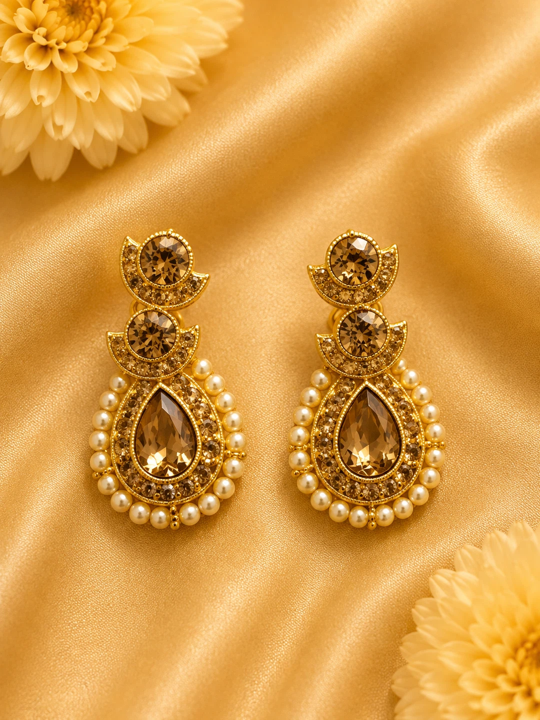 Gold-tone teardrop earrings with pearl and crystal details