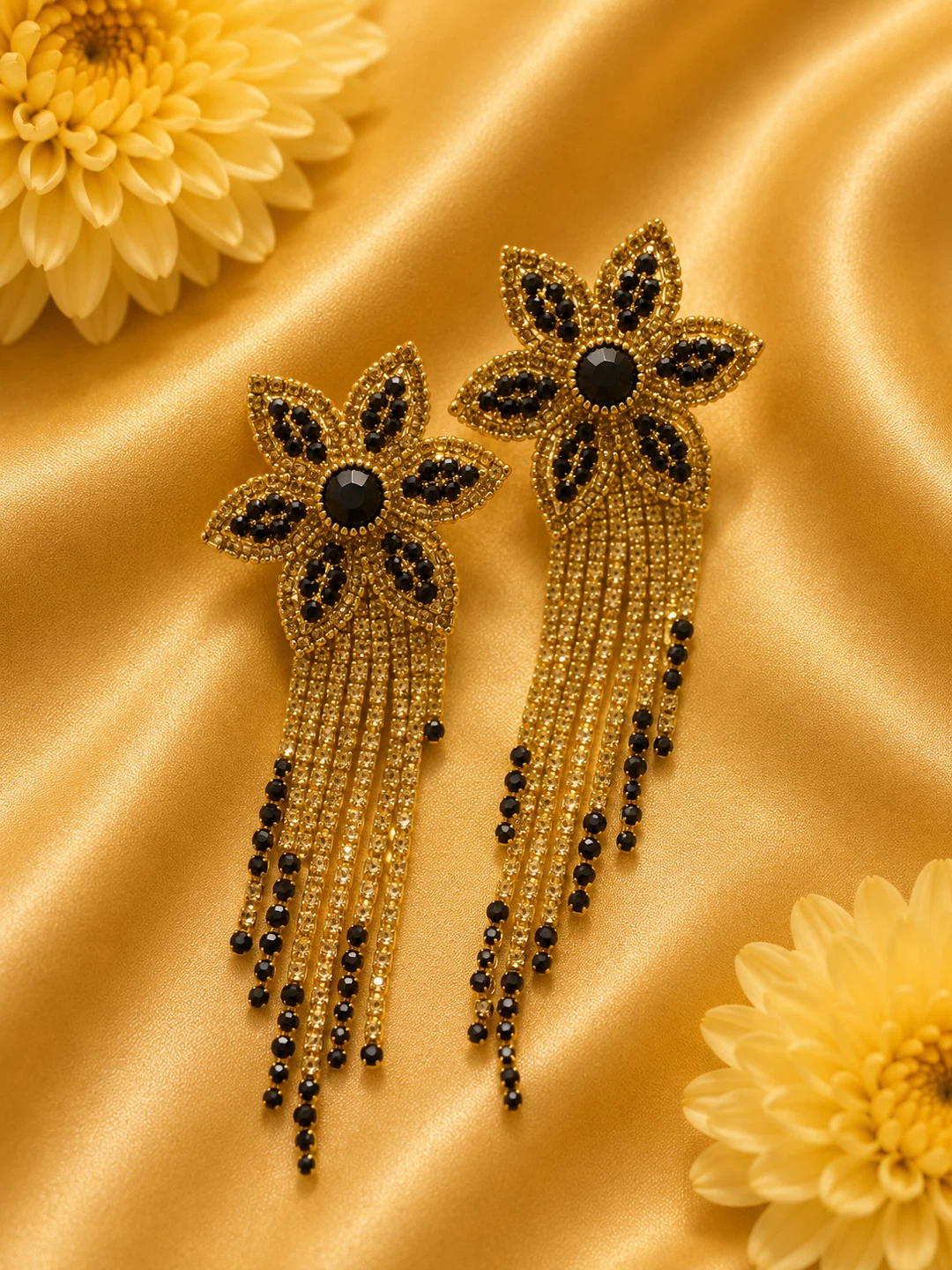Gold Flower Dangle Earrings with Black Gems