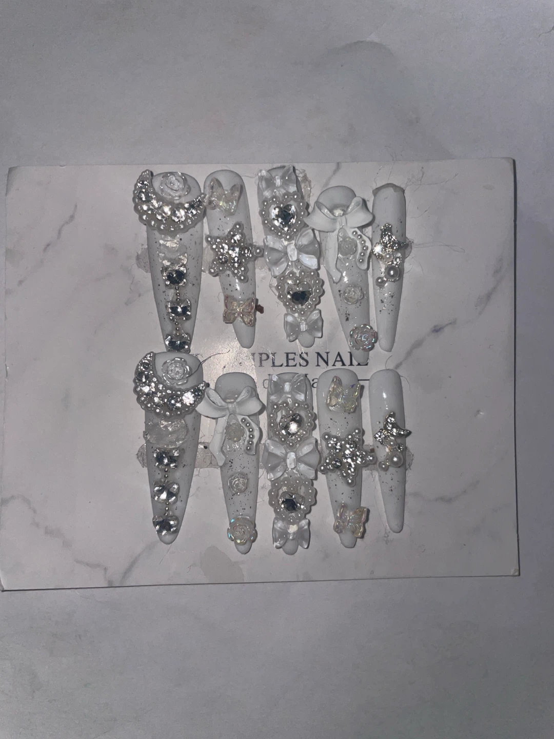 White Nails with Gems and Bows