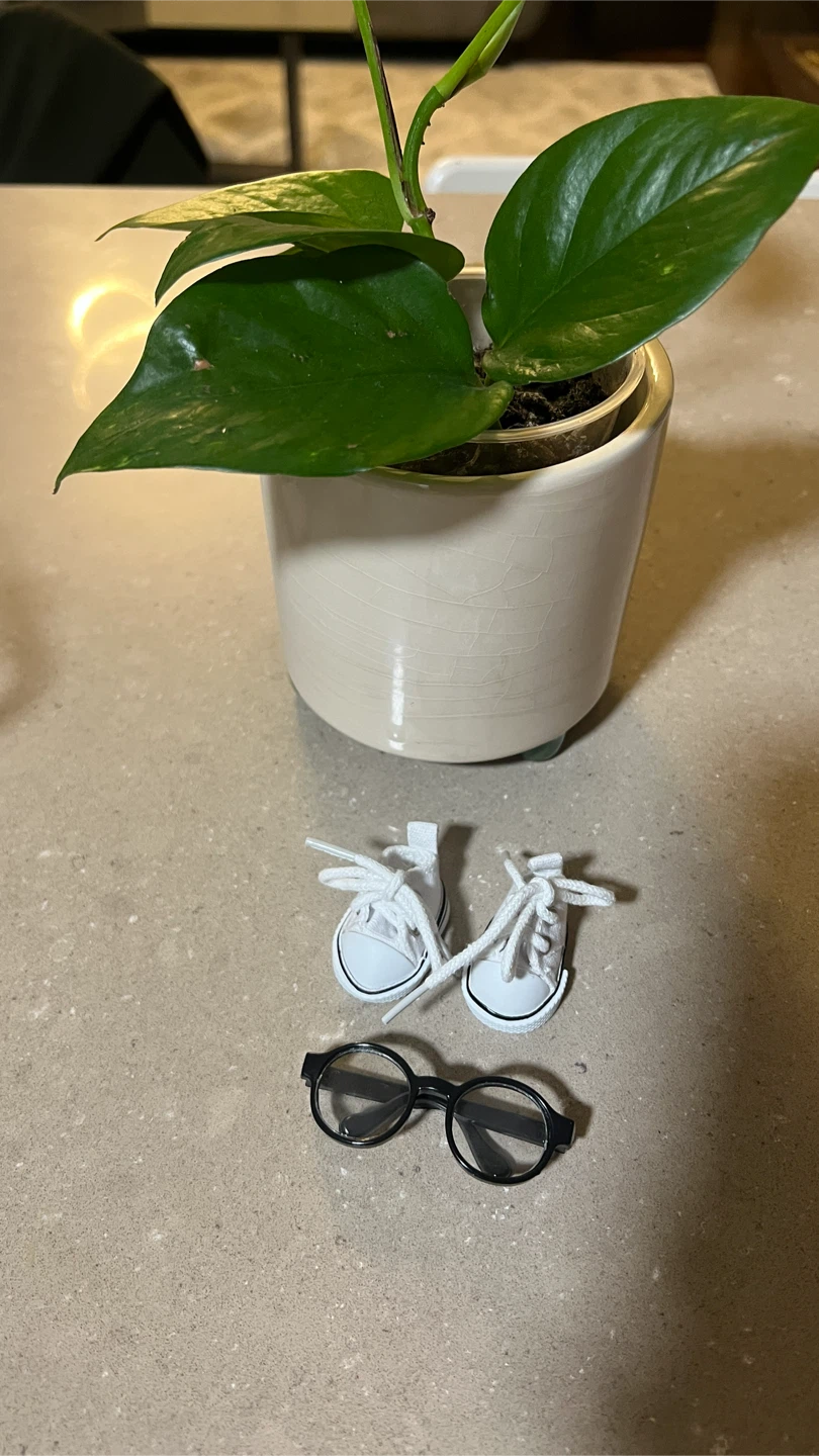 White miniature sneakers and black glasses - photo 2