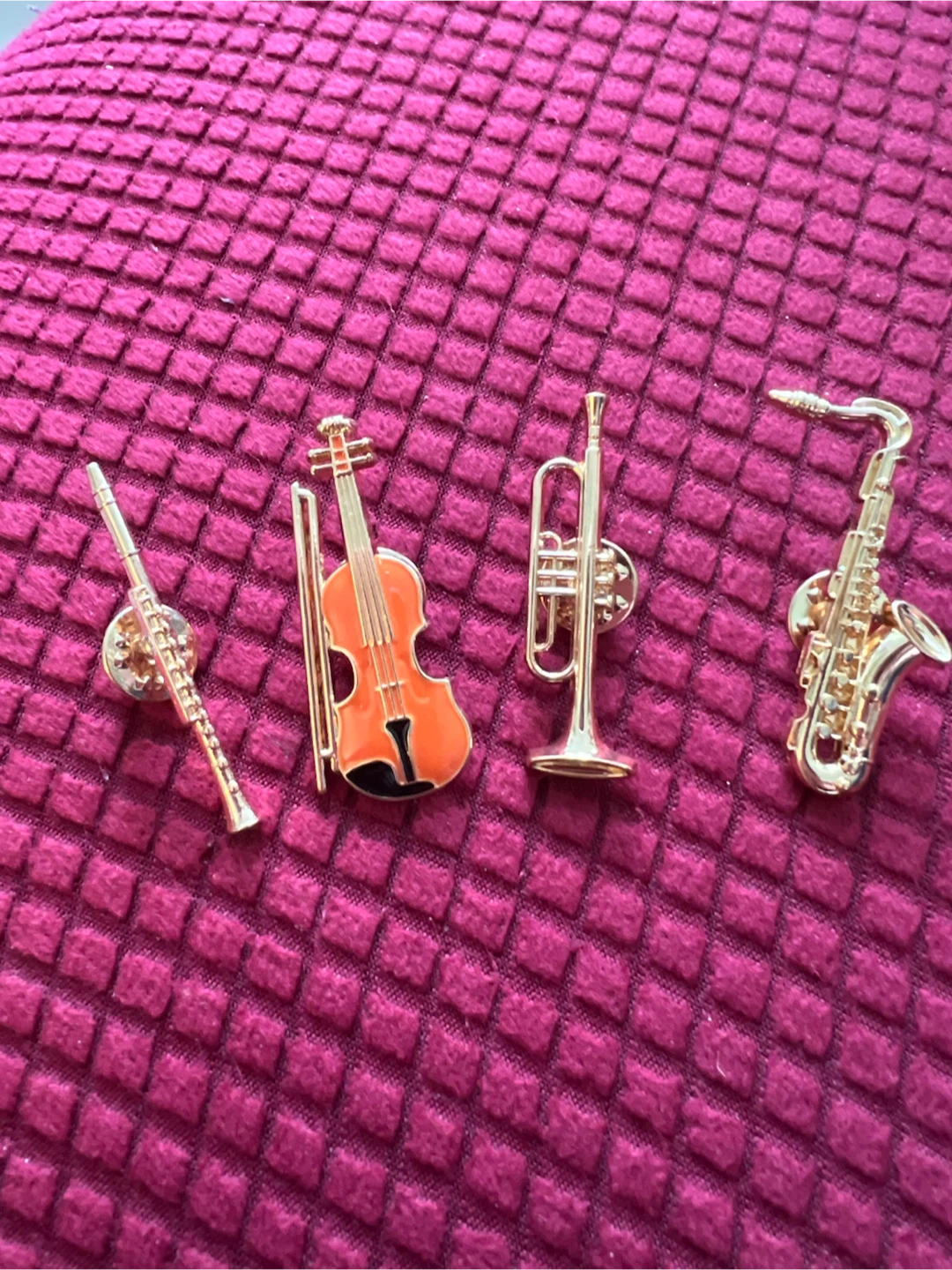 Musical enamel pins.