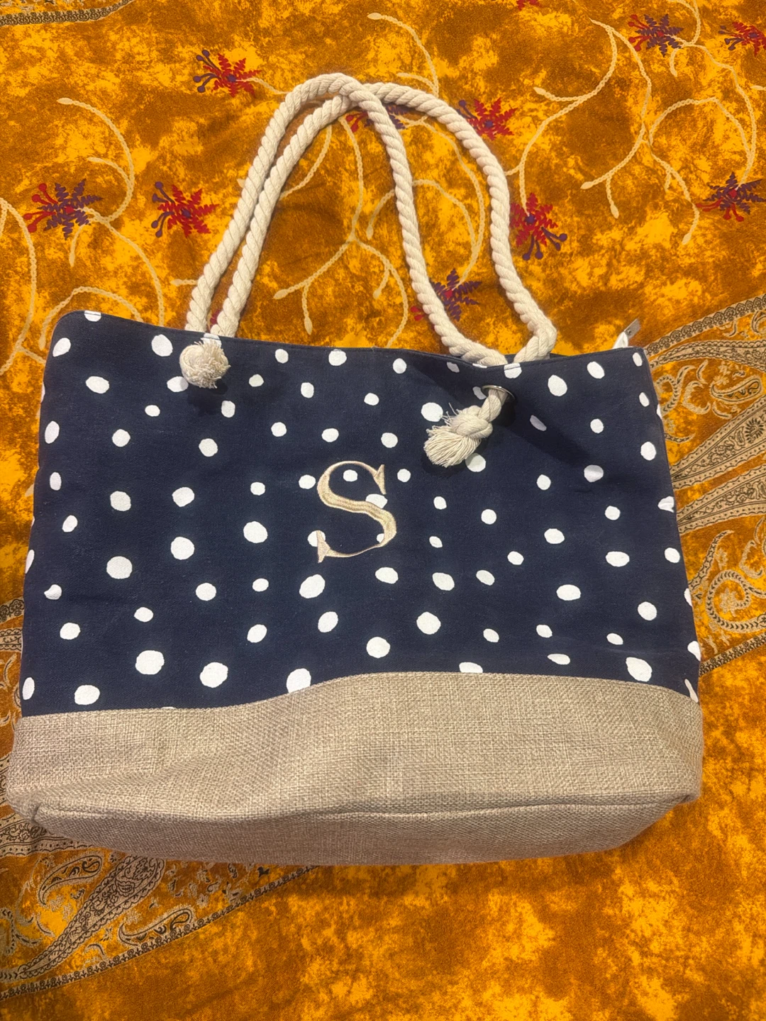 Navy polka dot tote bag with "S" initial