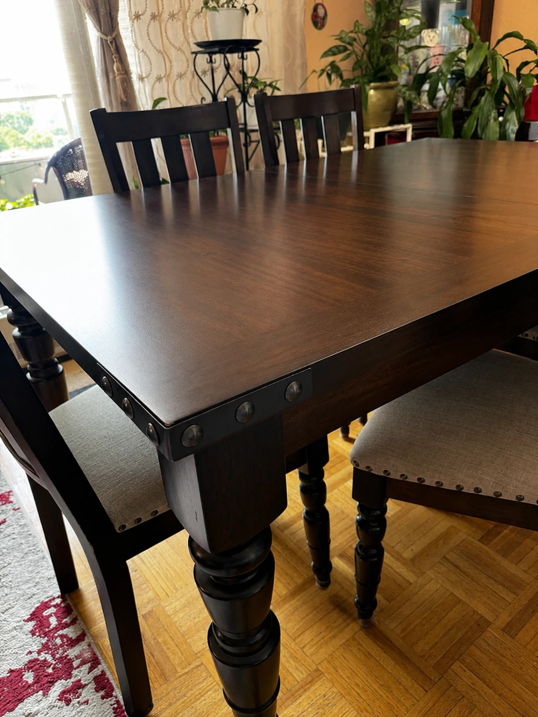 Dark Wood Dining Table with Rivet Accents