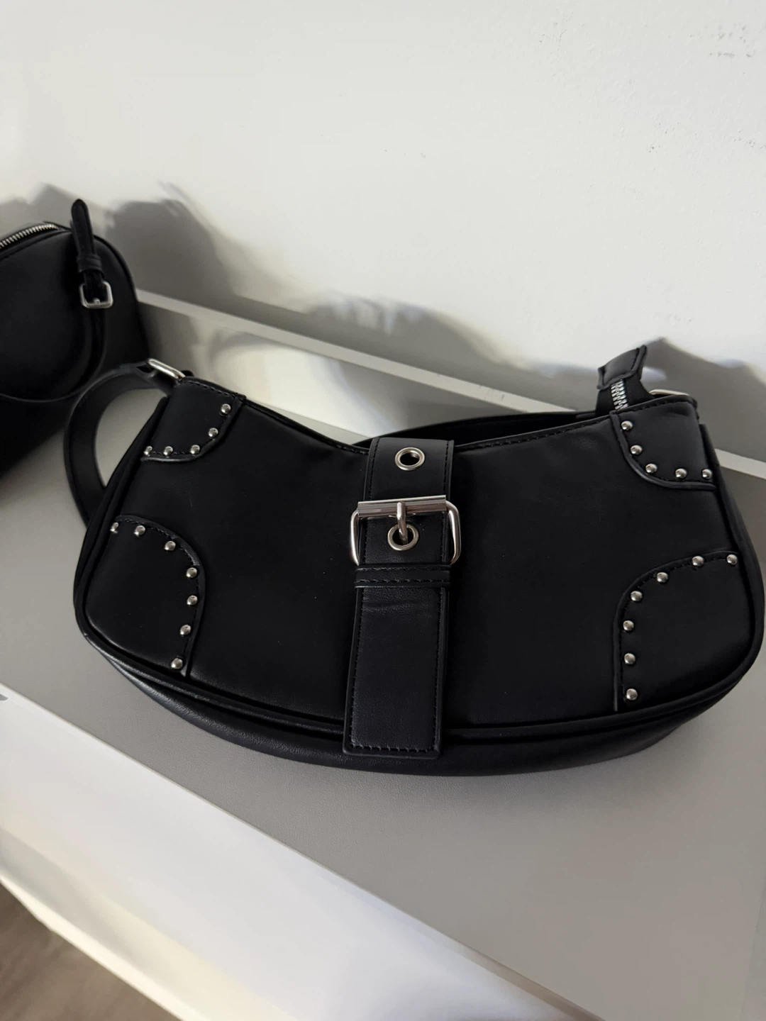 Black shoulder bag with silver stud details