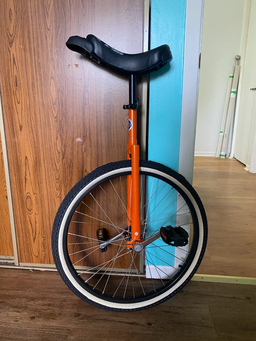 Orange Unicycle with Black Seat