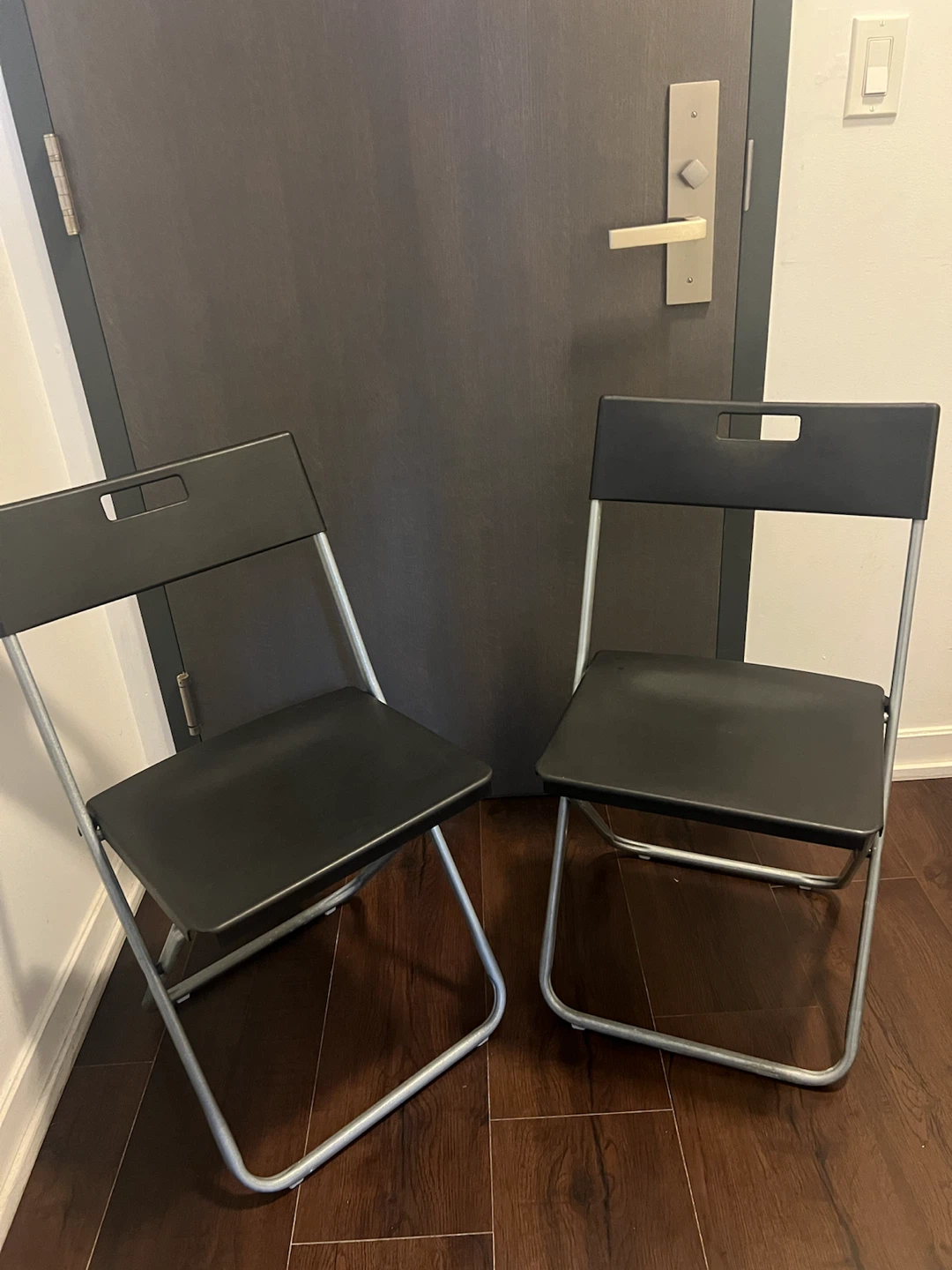 Two black folding chairs