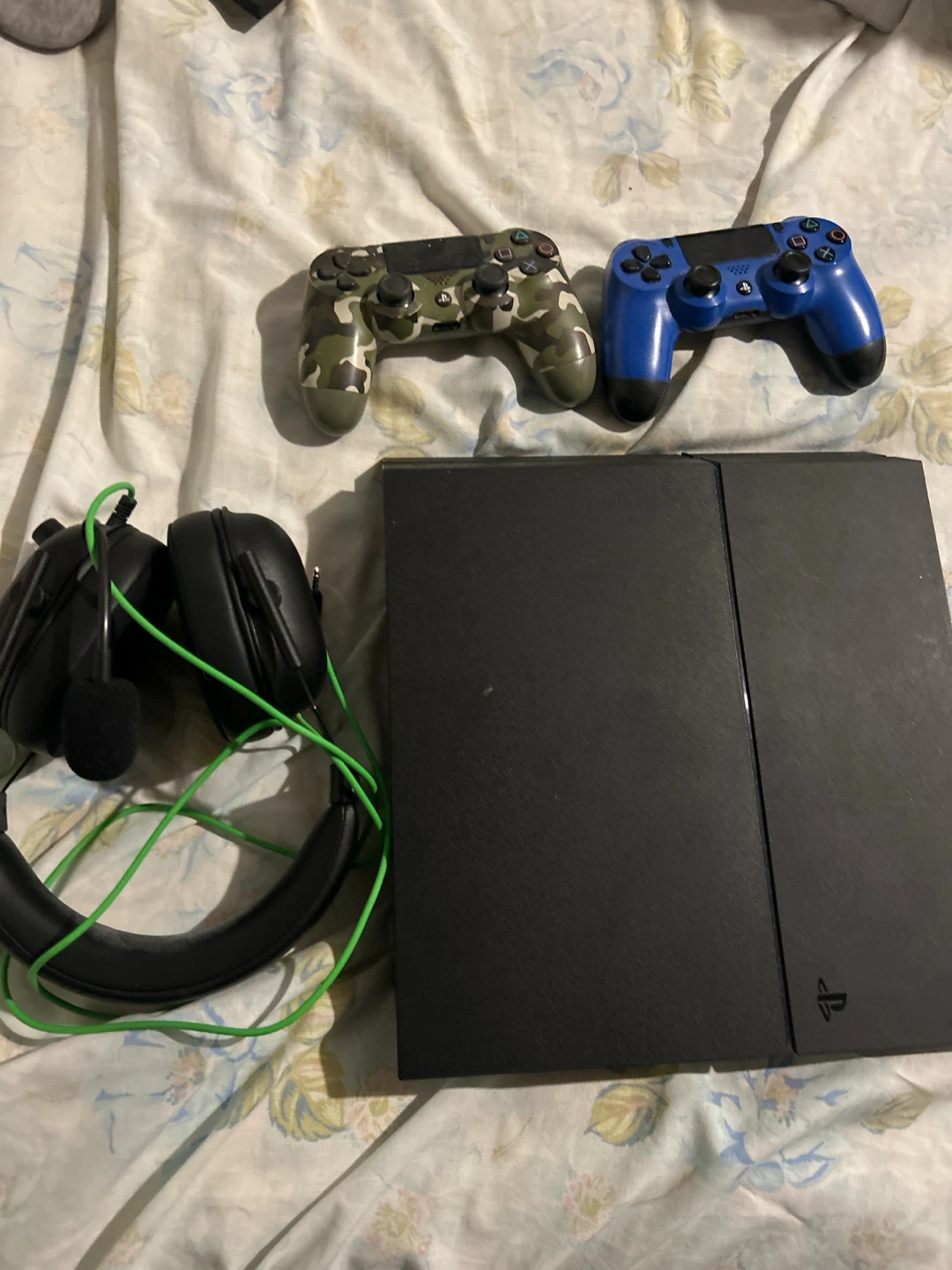 PS4 with 2 controllers and a headset
