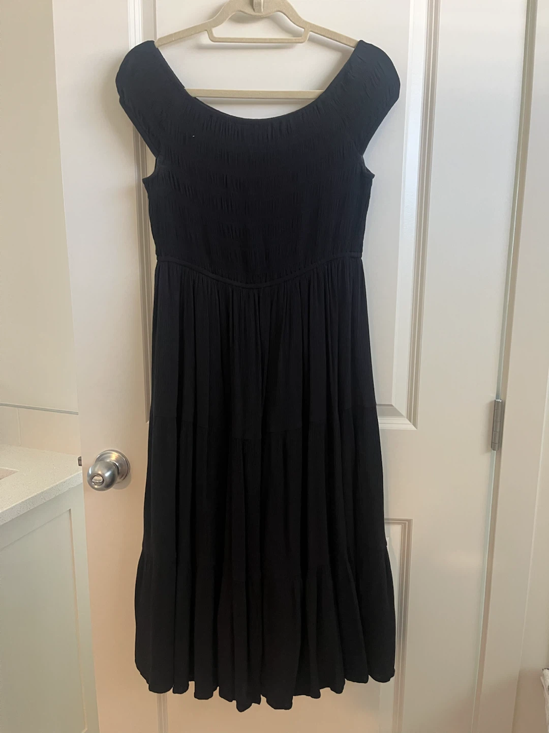 Black off-the-shoulder tiered midi dress