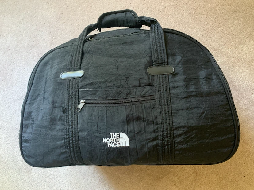 North Face Carry-On Bag with Retractable Handle and Wheels