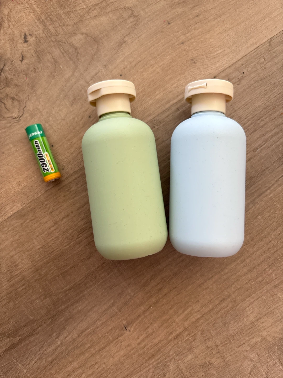 Two travel-sized bottles for shampoo