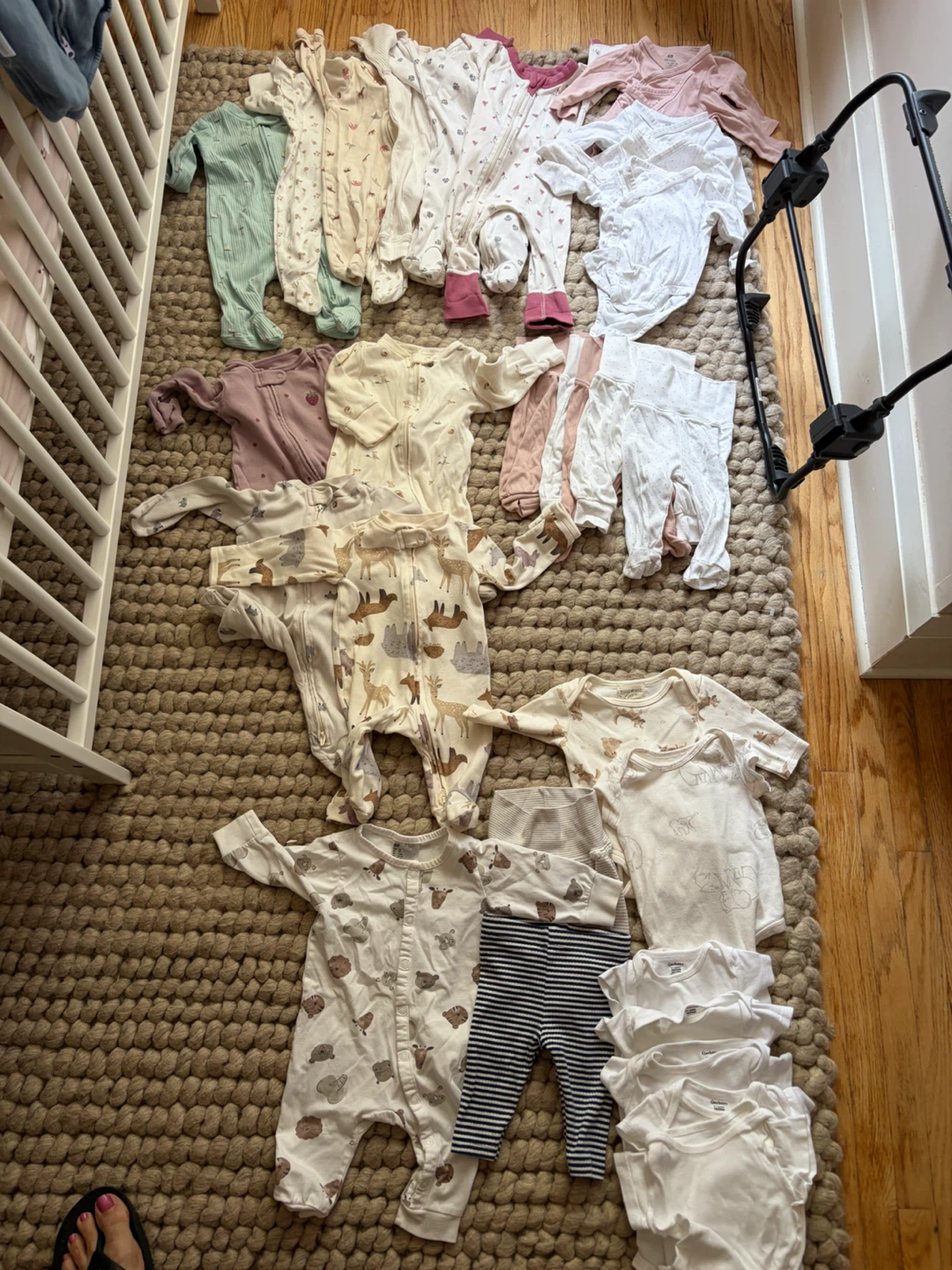 Bundle of newborn sleepsuits and bodysuits