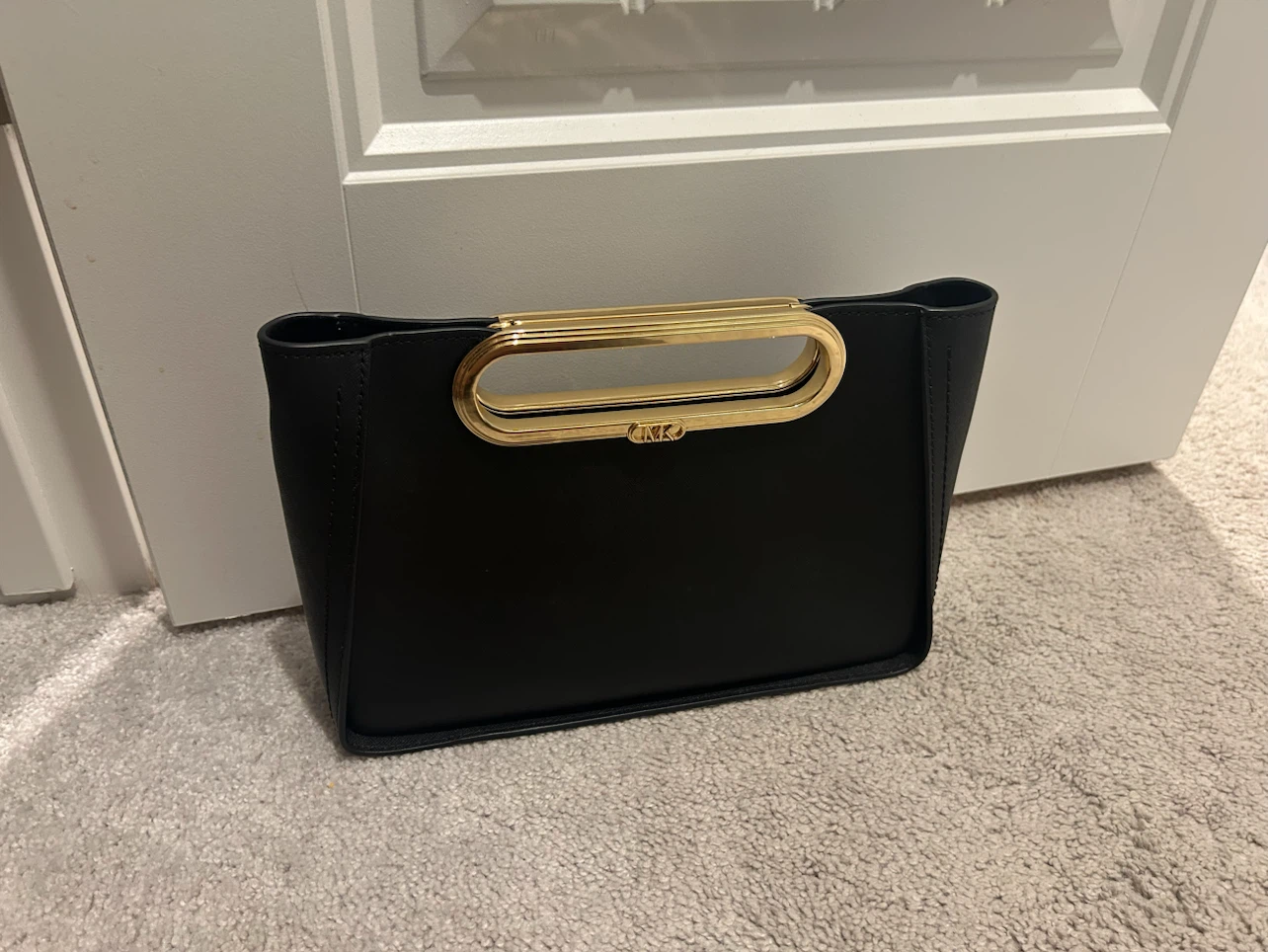 Micheal kors New York Black Clutch with Gold Handle