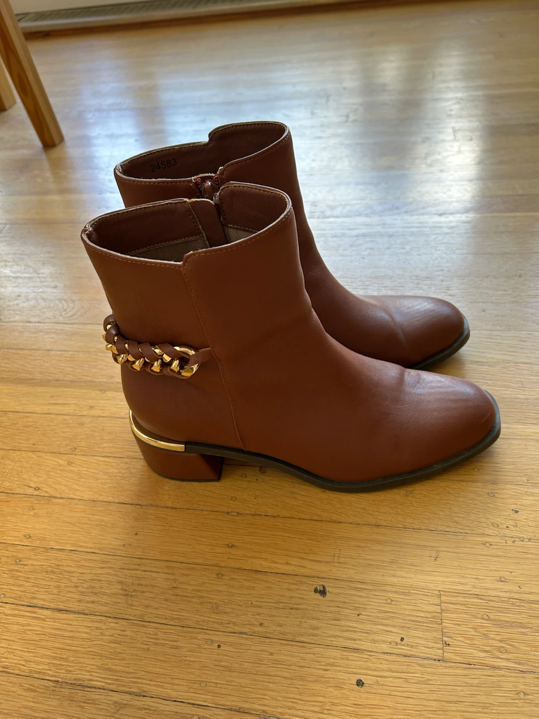 Brown ankle boots with gold chain detail