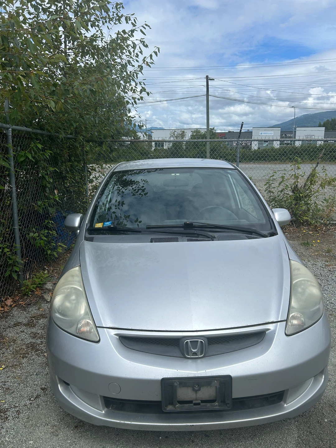 Silver Honda Fit - manual , selling $1,800