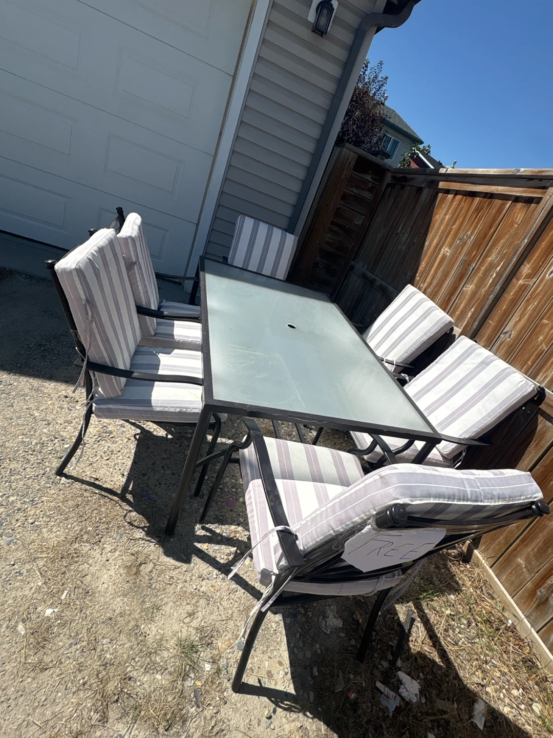 Patio Dining Set with Glass Table and Cushioned Chairs