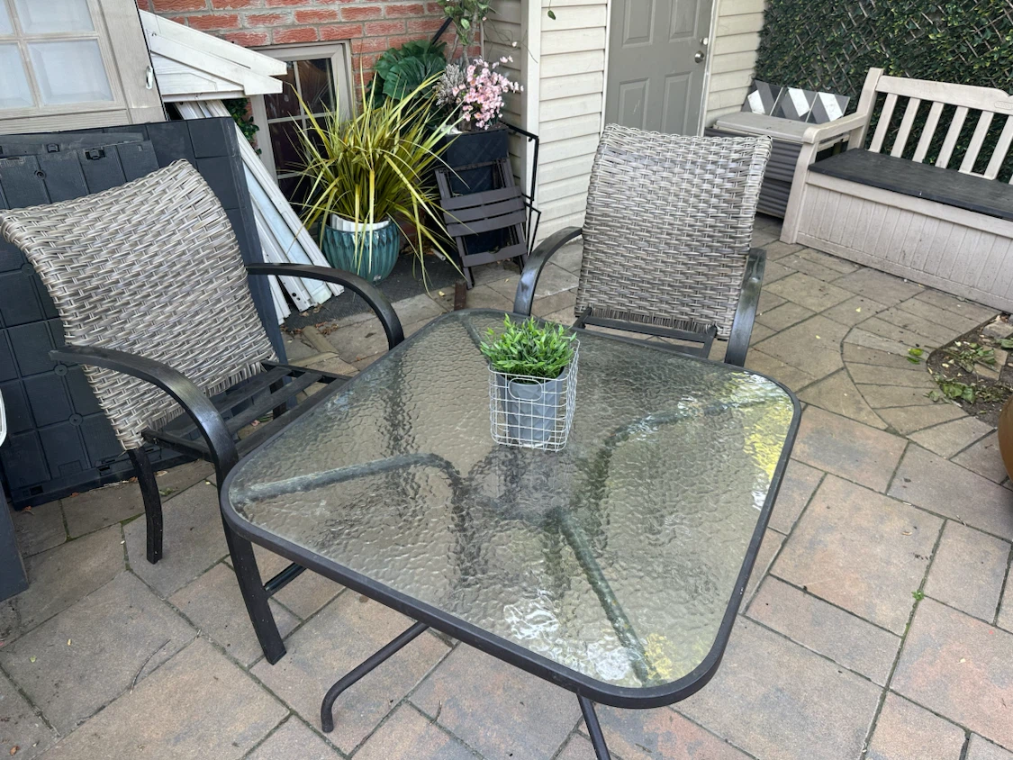 Glass Top Patio Table with Wicker Chairs