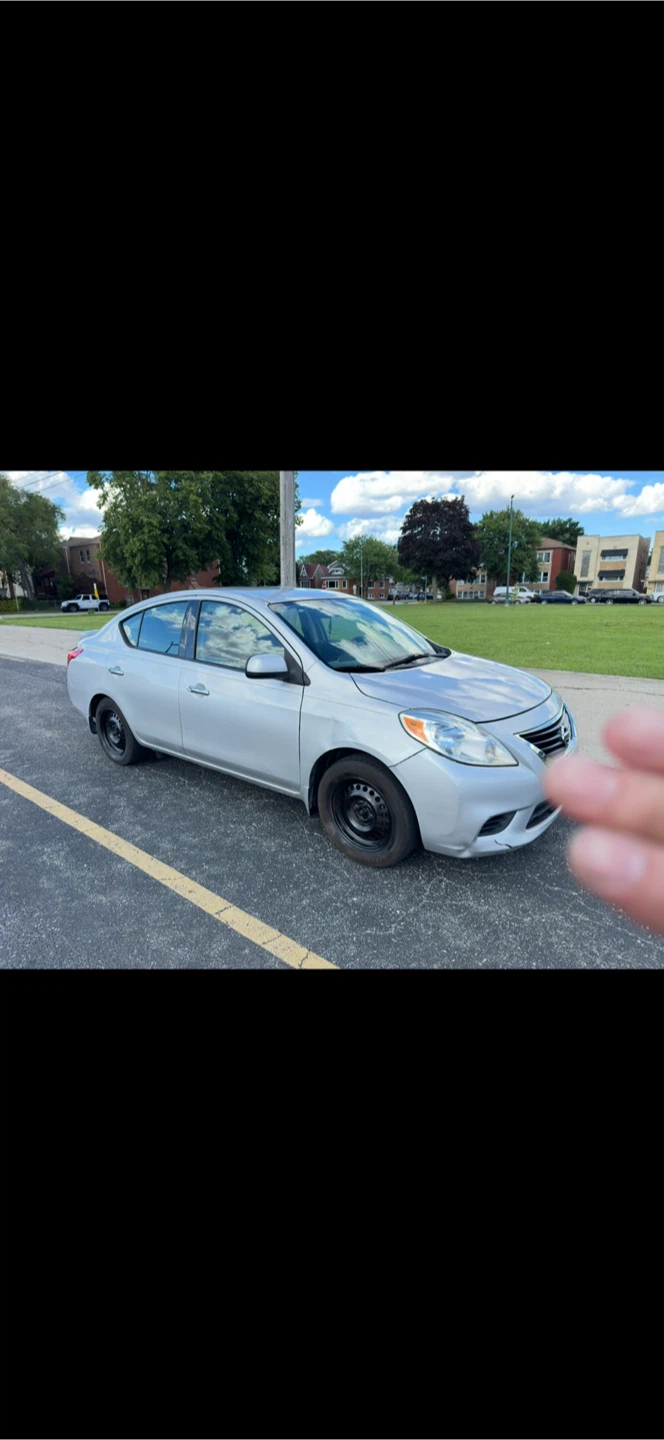 Silver Nissan Versa Sedan