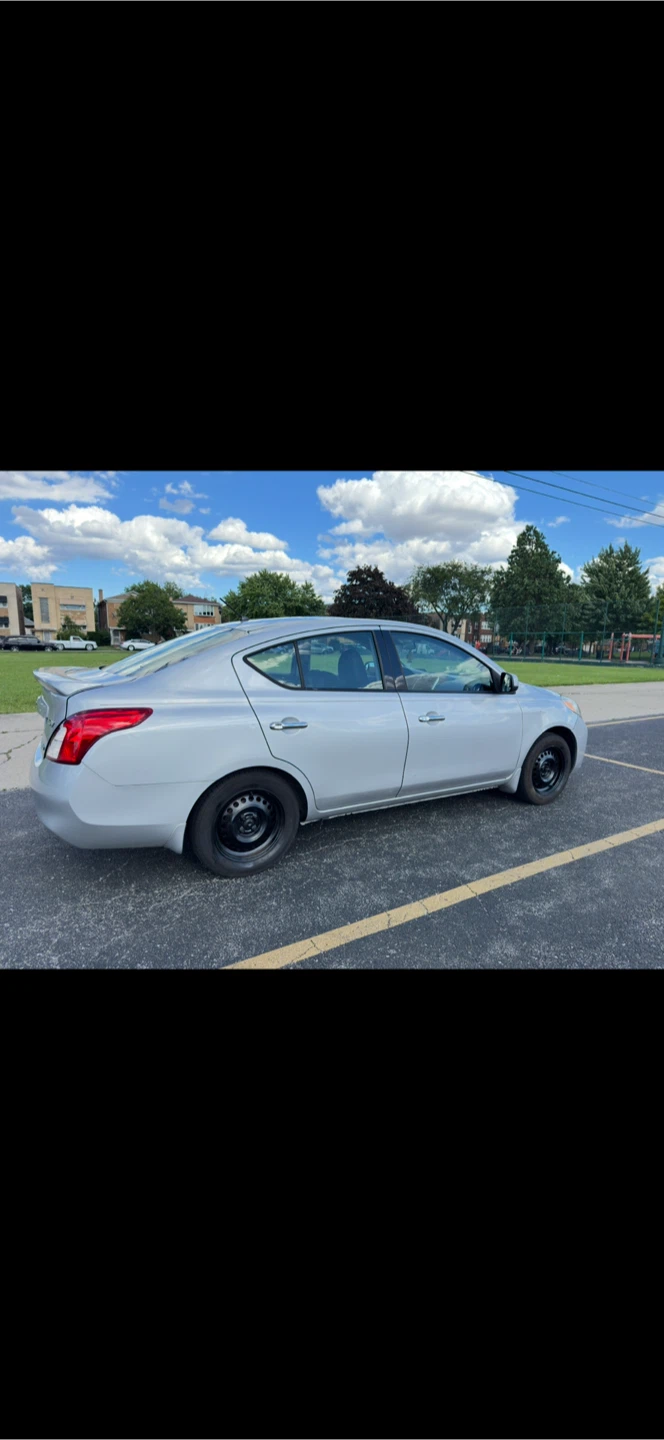 Silver Nissan Versa Sedan - photo 2