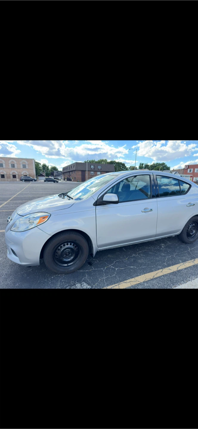 Silver Nissan Versa Sedan - photo 3