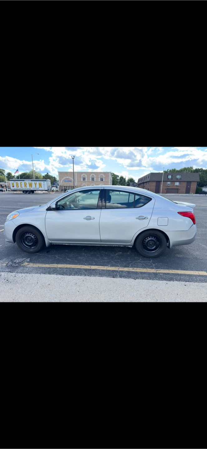 Silver Nissan Versa Sedan - photo 4
