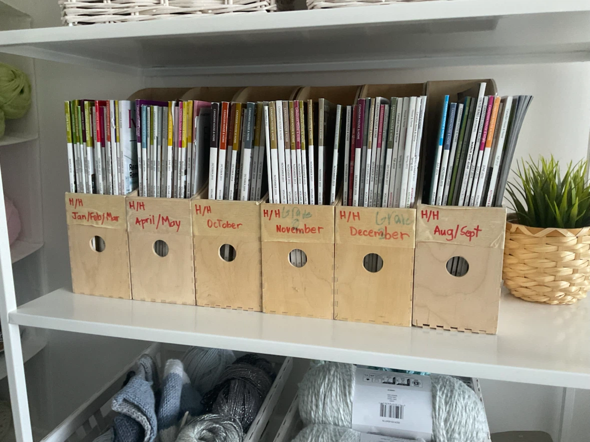 many house and home decorating magazines and file boxes