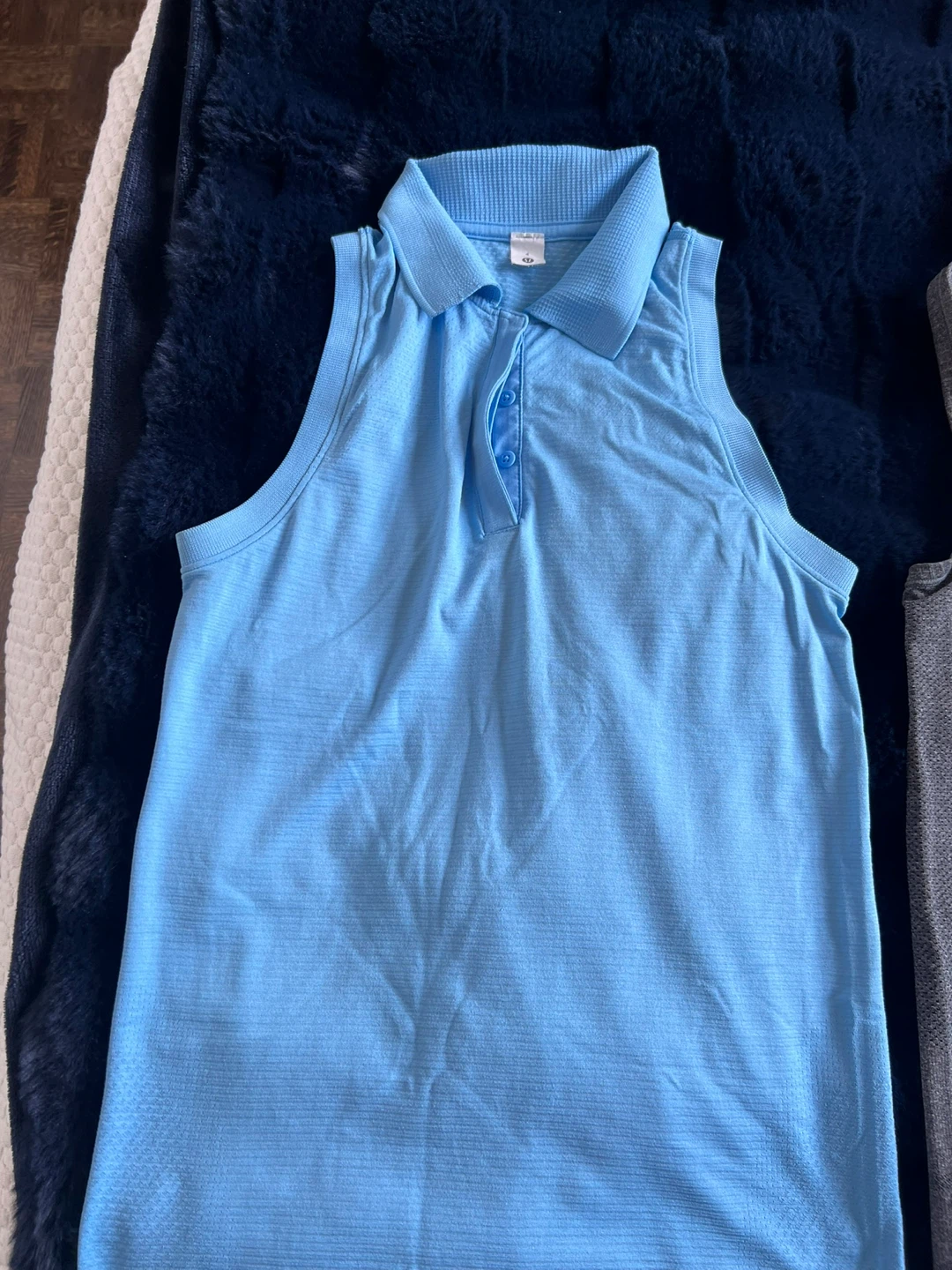 Three Lululemon Sleeveless workout shirts