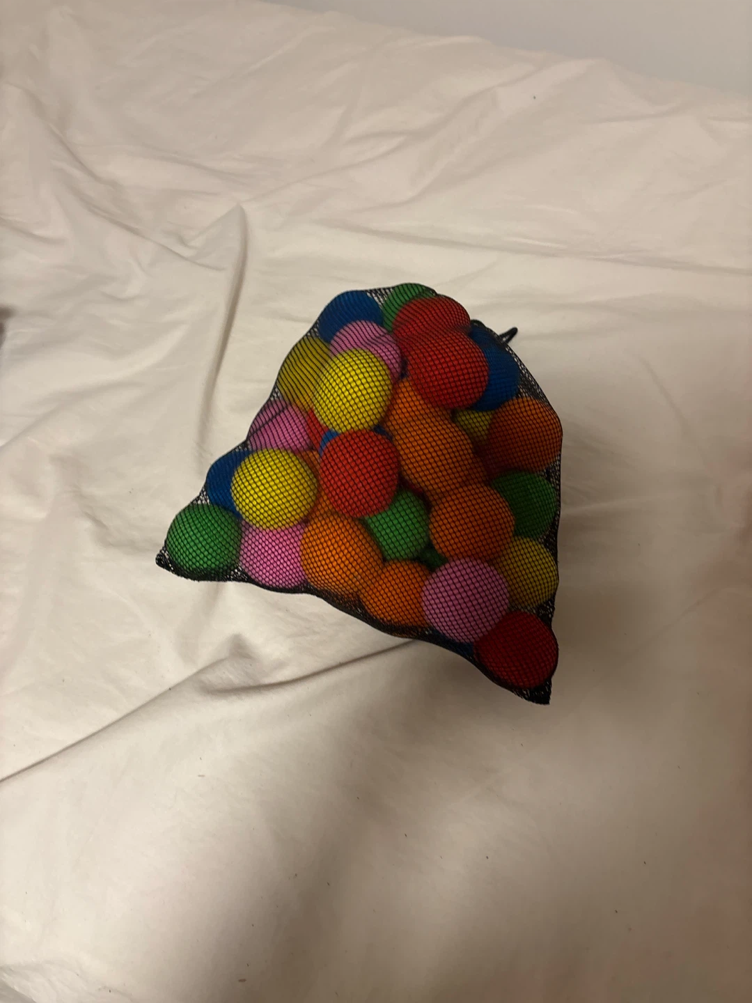 Bag of colourful plastic balls