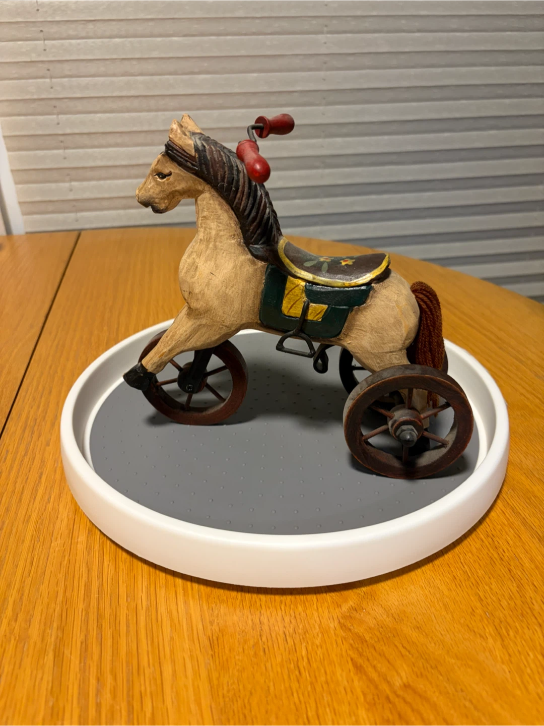 Wooden horse figurine with red handles