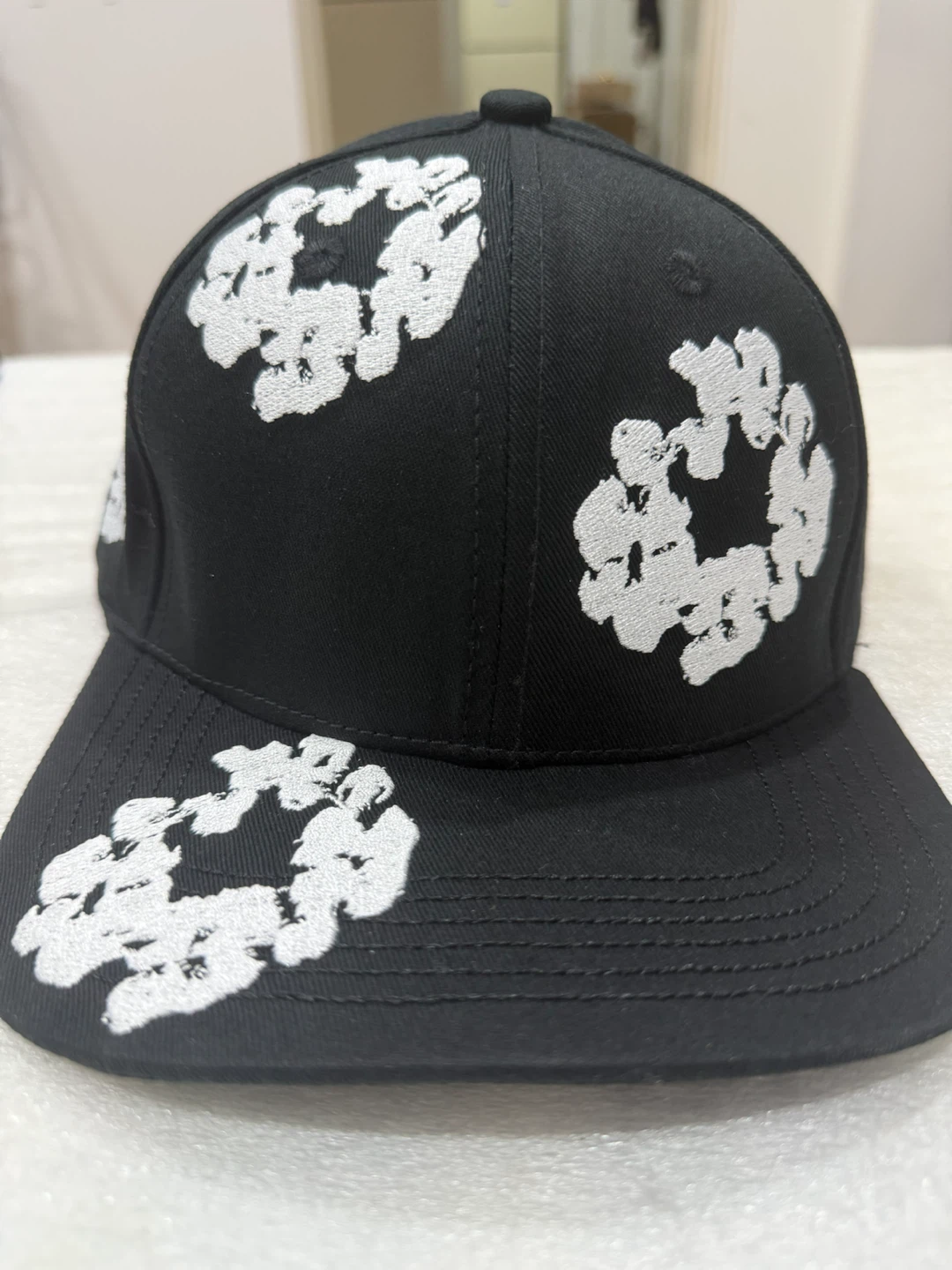 Denim tears Hat with White Embroidered Design