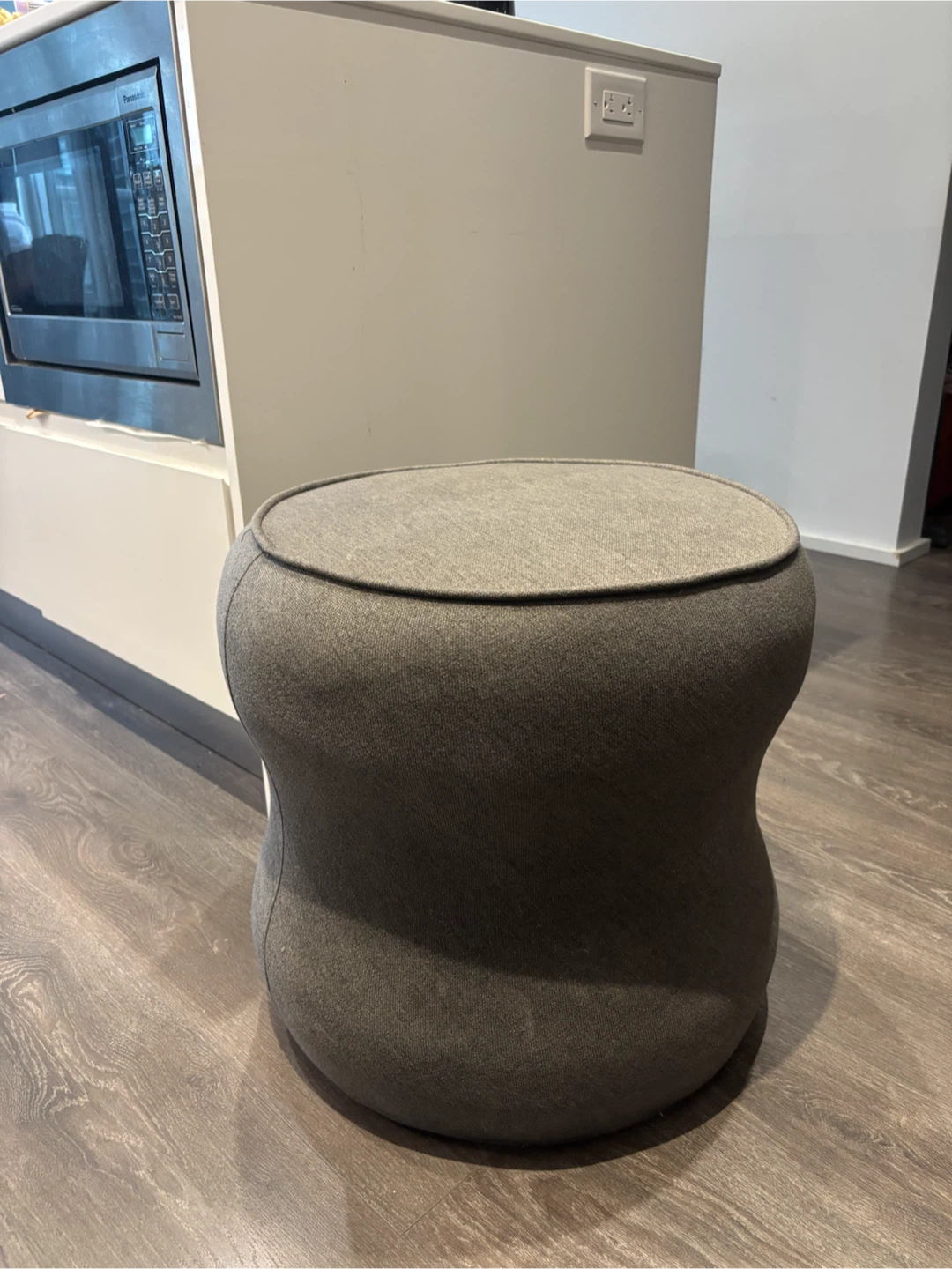 Grey Upholstered Round Pouf Ottoman