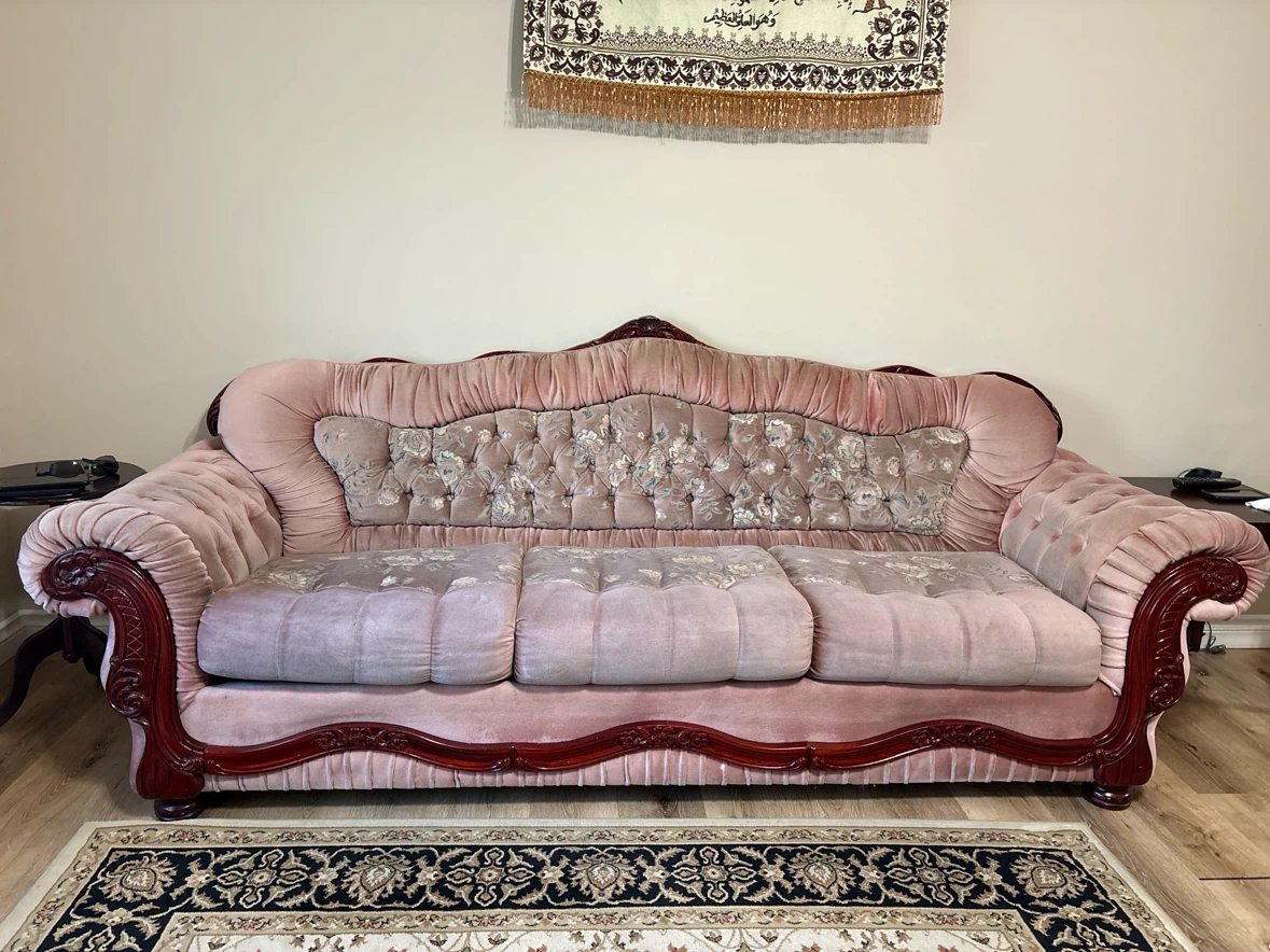Pink Velvet Sofa with Ornate Wood Trim