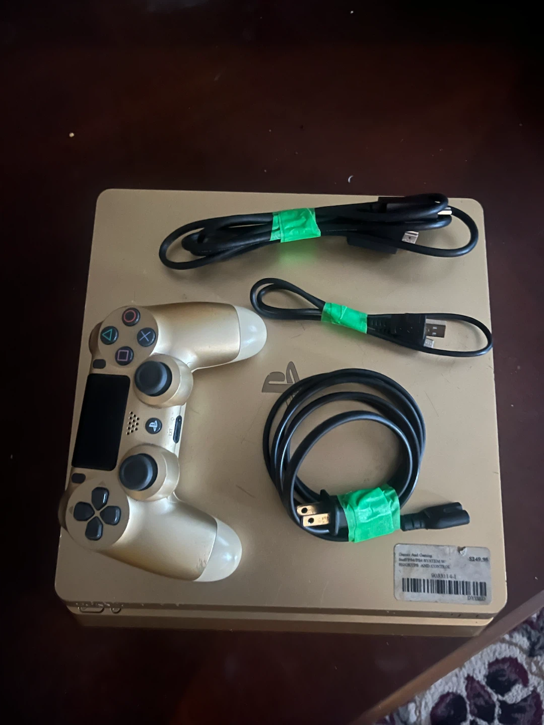 Gold PlayStation 4 Console with Controller and Cables