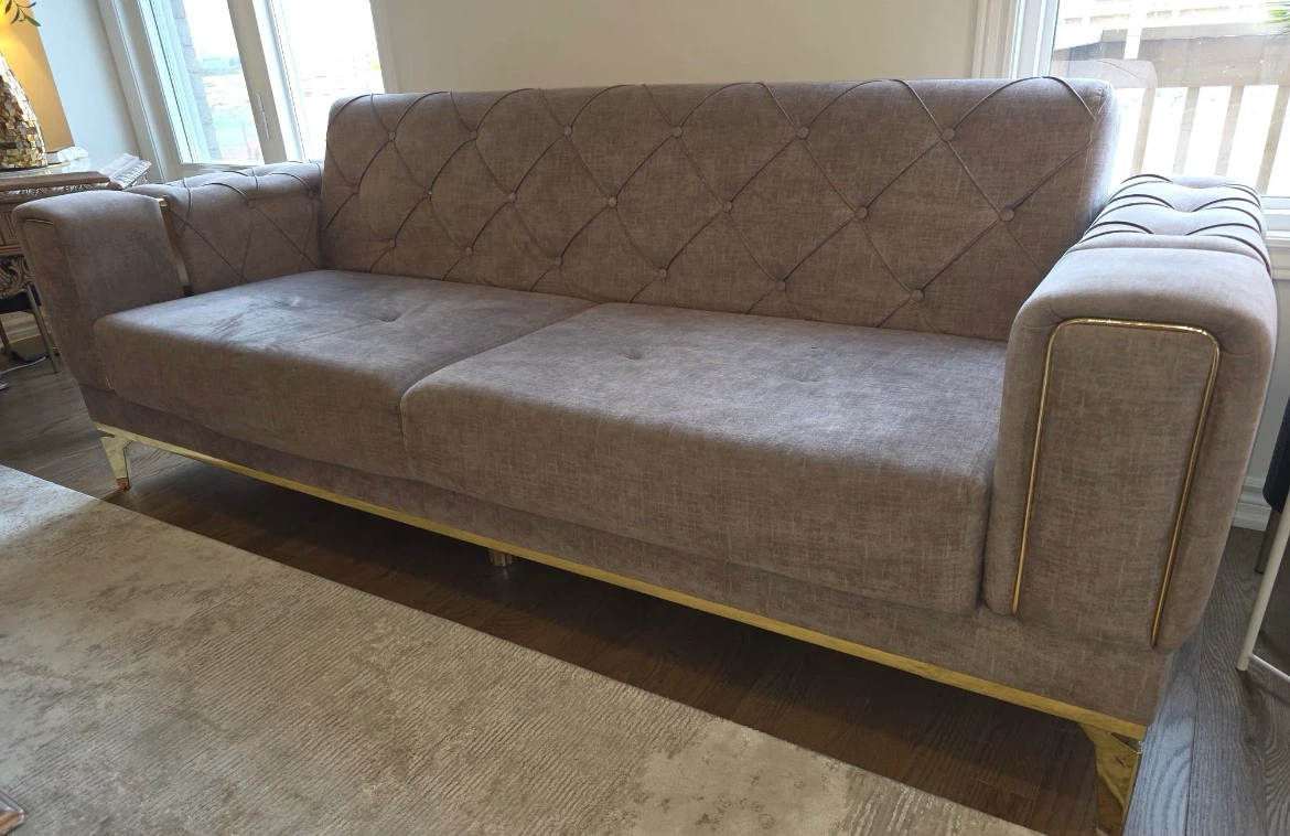 Tufted Sofa with Gold Accents