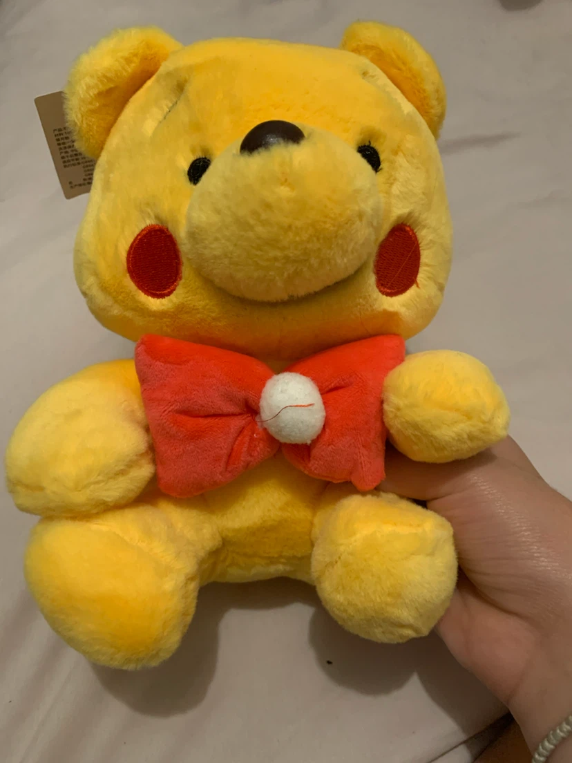 Winnie the Pooh with red bow tie plushie
