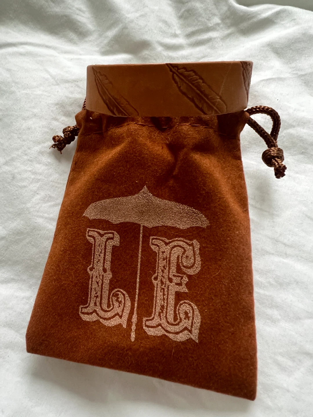 LE Leather Bracelet with Drawstring Pouch