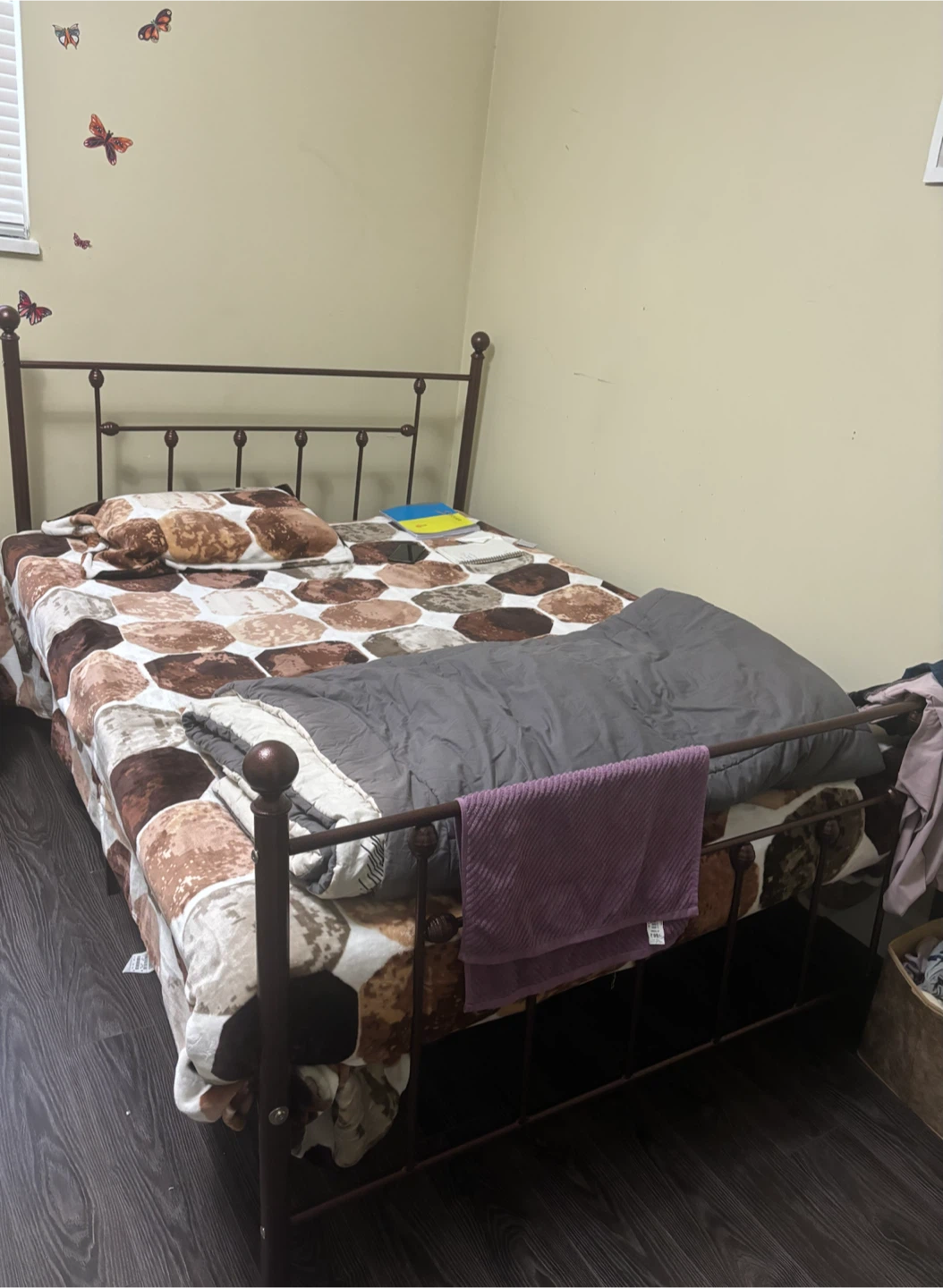 One queen size metal bed frame , mattress and a table