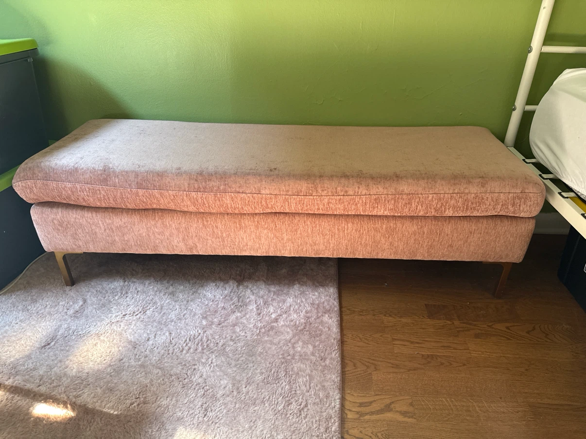 Pink plush bench with gold legs