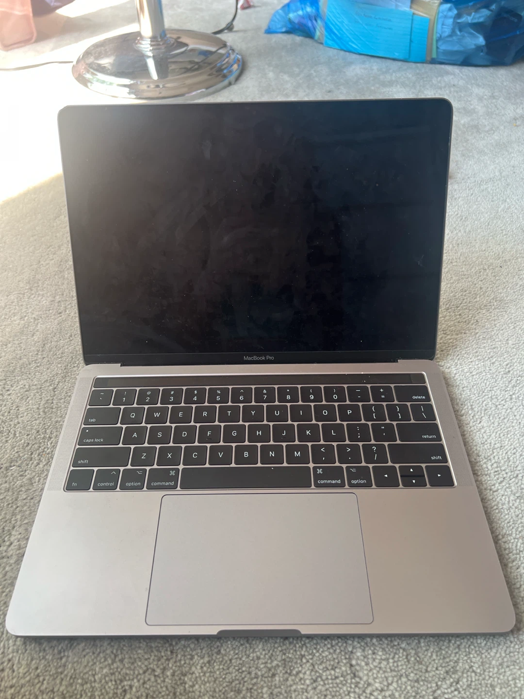 Apple MacBook Pro Laptop with touch bar valued 300+