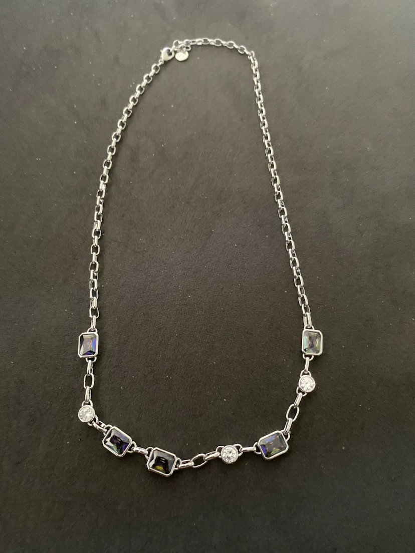 Silver-tone necklace with square and round gems